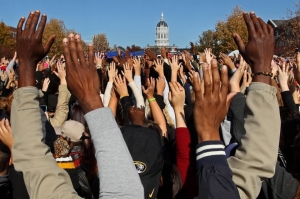 (image by america.aljazeera.com) Protestors raising their hands at the University of Missouri earlier this week. 