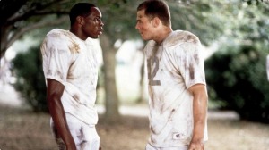 (image by news.moviefone.com) The characters of Julius Campbell and Gerry Bertier acknowledging each other in the 2000 film Remember The Titans.